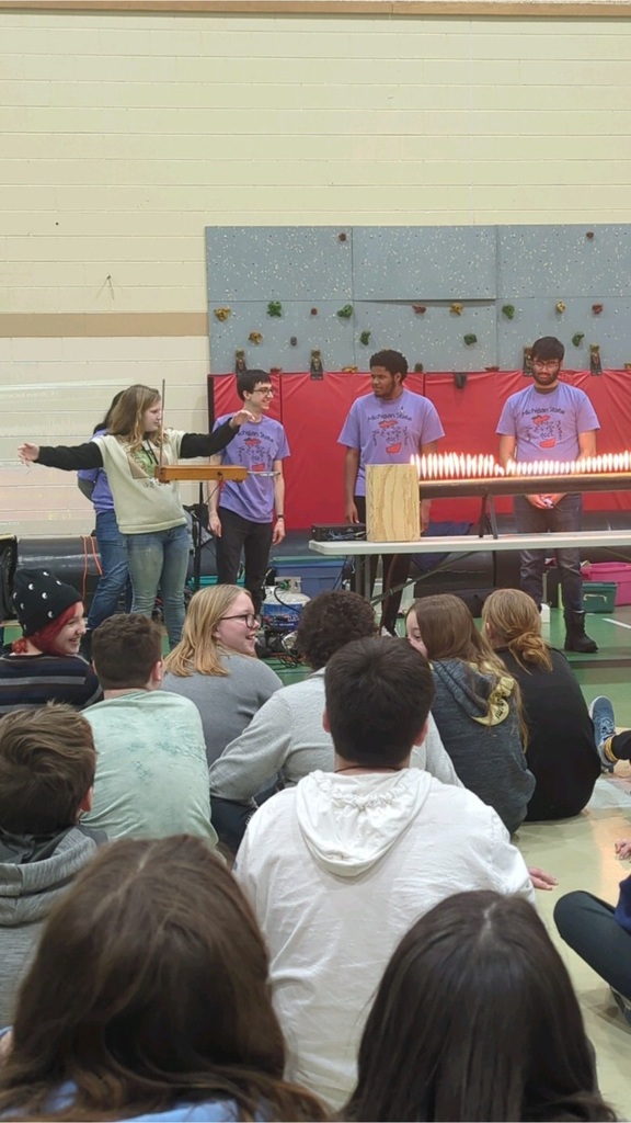 Students engaged onstage for experiment 