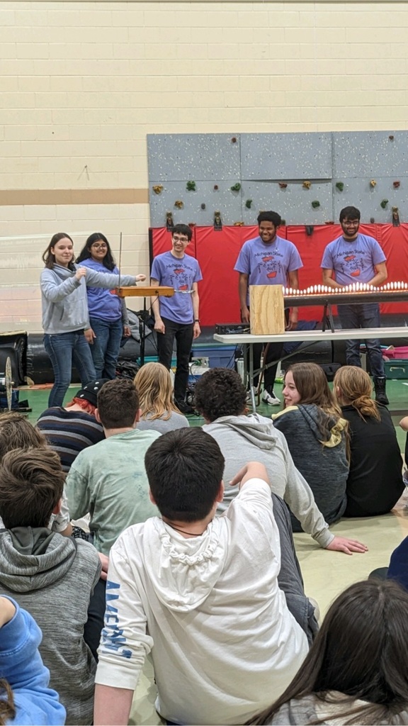 Students engaged onstage for experiment